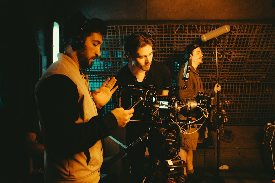 Video production team filming with professional camera equipment