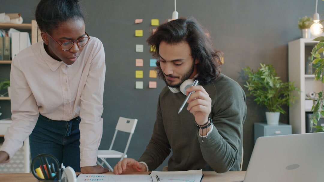 Diverse media education team working together in a modern office