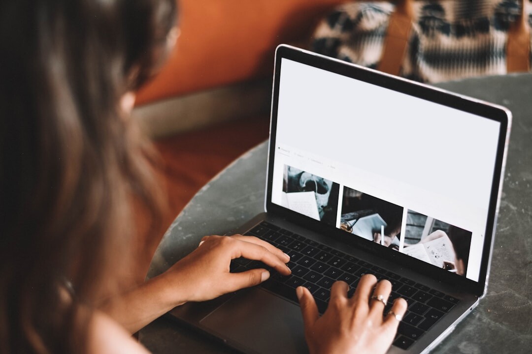 Digital journalist working on laptop with media content
